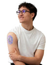 Smiling man using Dexcom G6 Sensor with adhesive patches for diabetes management